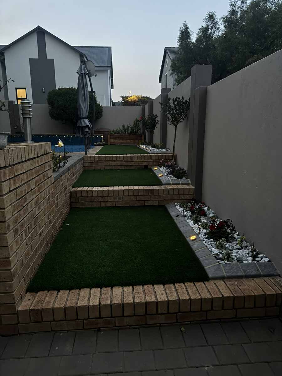 Easy Edge SA Stepping-Stone Walkway Paving with Lawn and Cobble Kerbing
