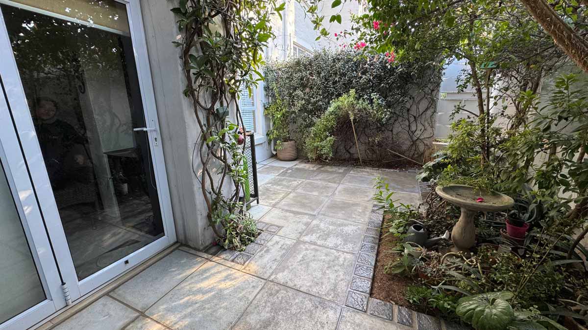 Easy Edge SA courtyard paving installation viewed from sliding door